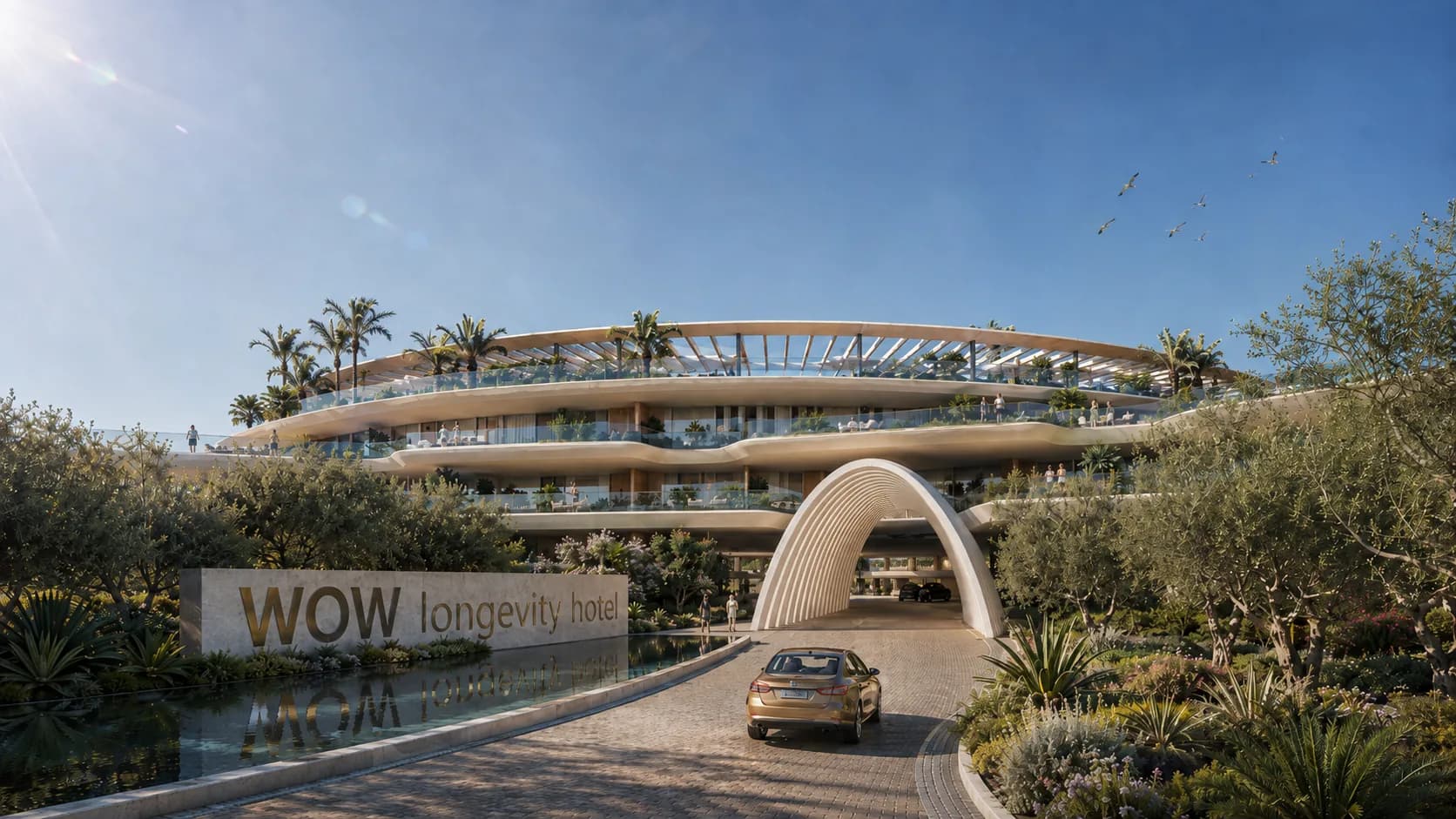 The arrival drive and entrance arch of the WOW Longevity Hotel